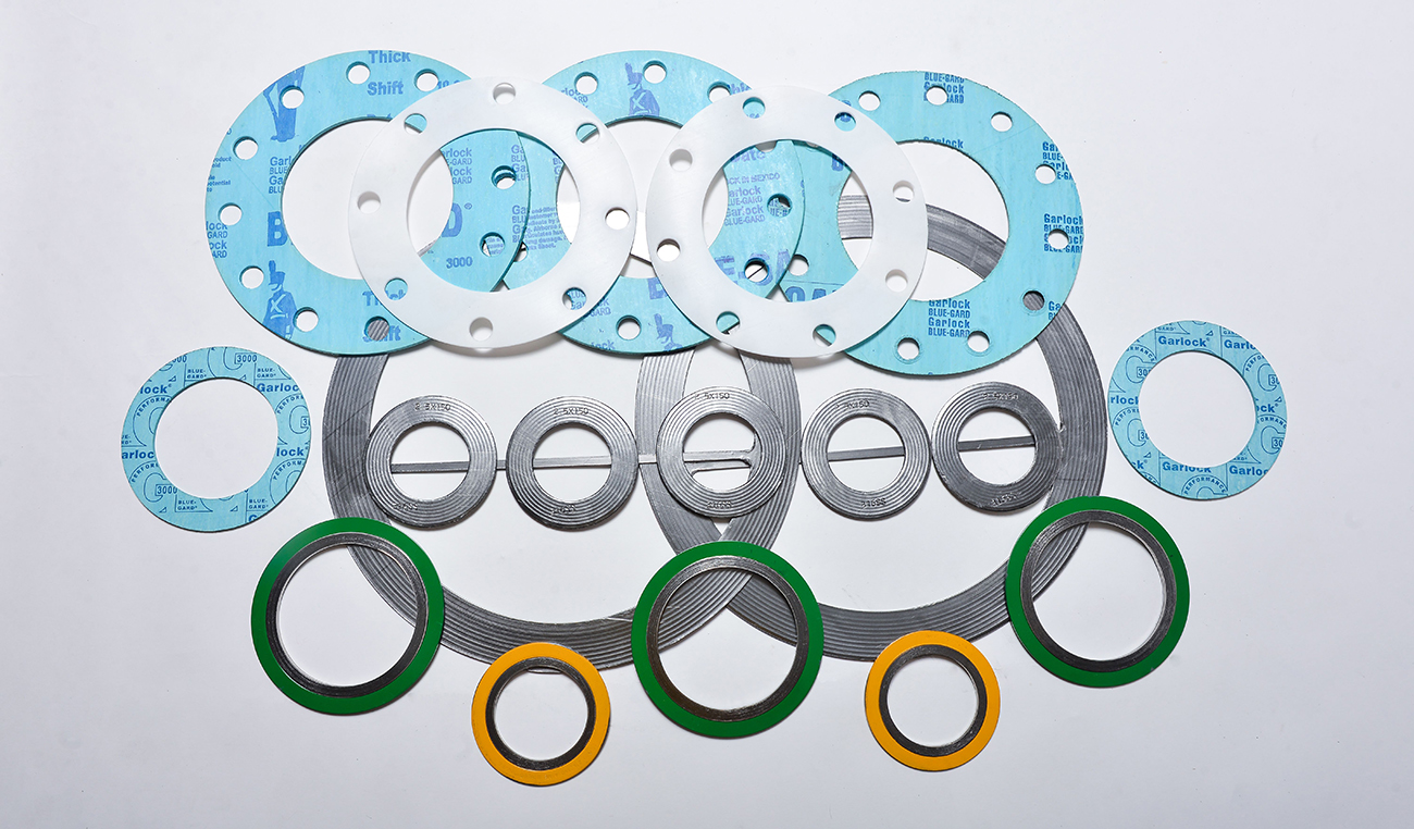 Spiral wound gasket, corrugated metal gasket, and soft gasket materials displayed for industrial sealing applications